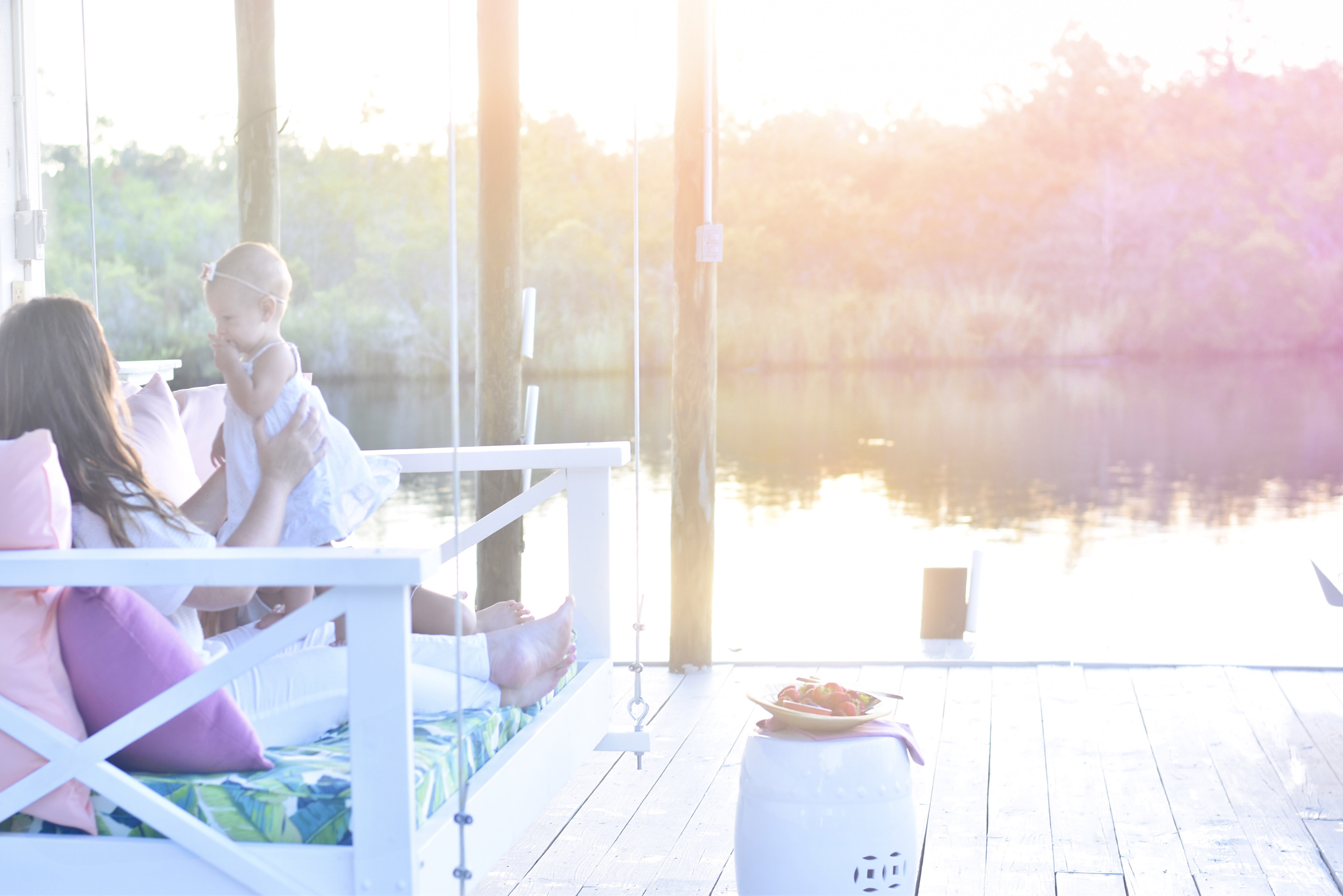 Jami Ray's chic swing bed on the dock by Nate and Lane