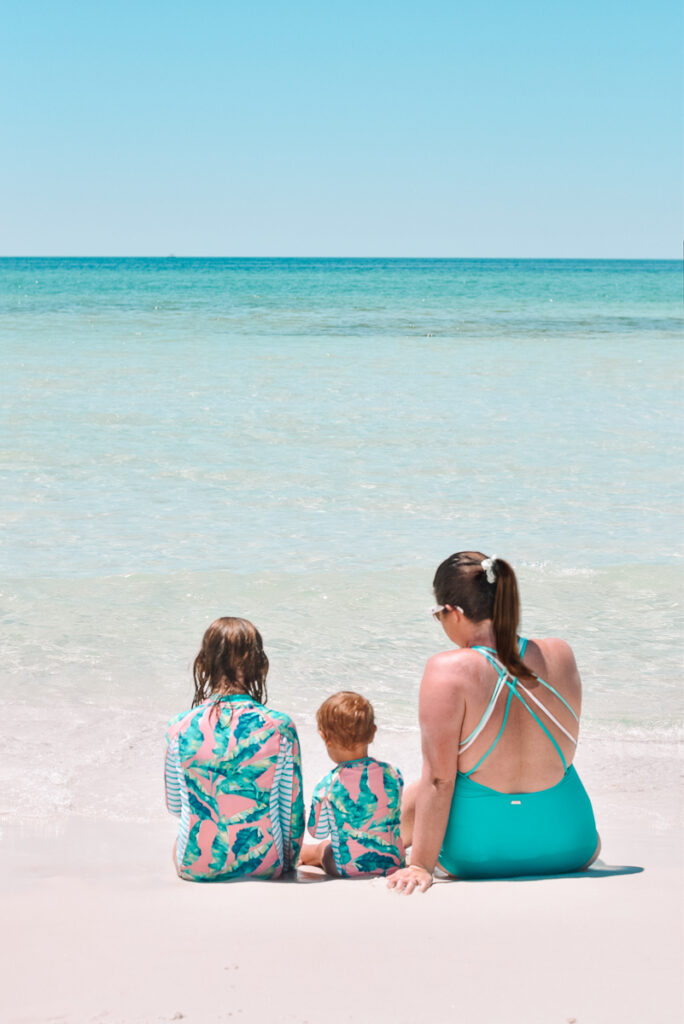 30A Mama wearing Cabana Life swimsuits on white sand - mommy and me